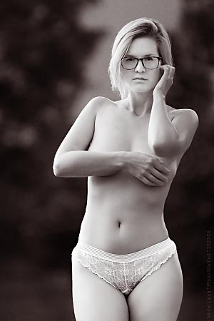 Implied semi-nude photograph of a young woman.